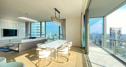 Modern living room with city view, elegant furniture, and ample natural light