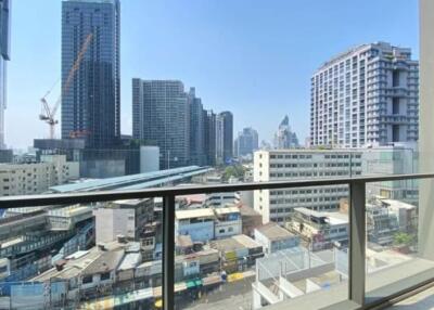 Urban high-rise apartment balcony overlooking skyline