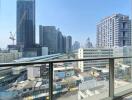 Urban high-rise apartment balcony overlooking skyline