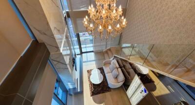 Elegant living room with modern furnishings and chandelier