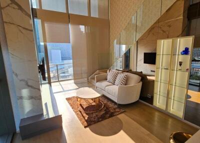 Spacious and modern living room with large windows and city view