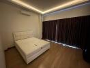 Modern bedroom with elegant lighting and minimalistic design
