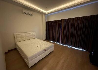 Modern bedroom with elegant lighting and minimalistic design