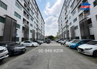Exterior view of modern residential buildings with parked cars