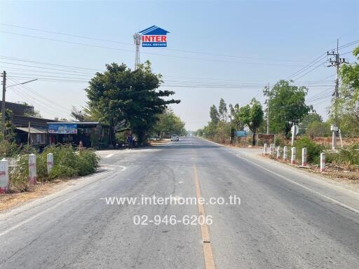 Wide street view with real estate advertisement