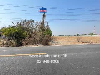 Empty land for sale with clear sky and road access