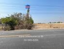 Empty land for sale with clear sky and road access