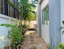 Tropical garden path beside modern building