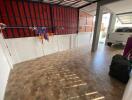 Spacious garage with tile flooring and ample storage space