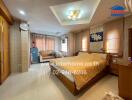 Spacious and well-furnished master bedroom with elegant interior design