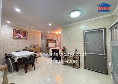 Spacious and well-lit living room with dining area