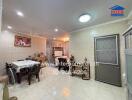 Spacious and well-lit living room with dining area