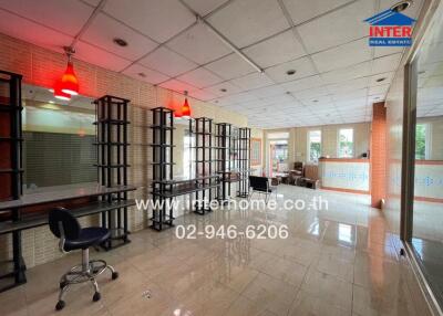 Spacious commercial real estate interior with reflective flooring and large mirrors