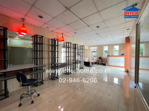 Spacious commercial real estate interior with reflective flooring and large mirrors