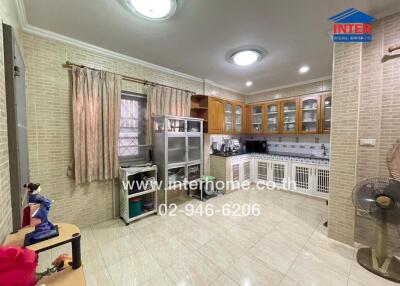 Spacious kitchen with modern appliances and ample lighting