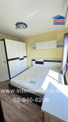 Bright and modern furnished bedroom with spacious wardrobe and large window