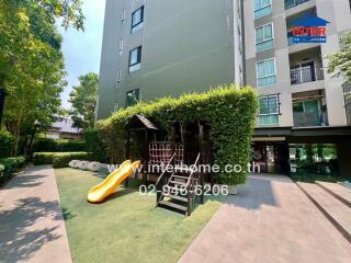 Outdoor playground with slide in a residential apartment complex