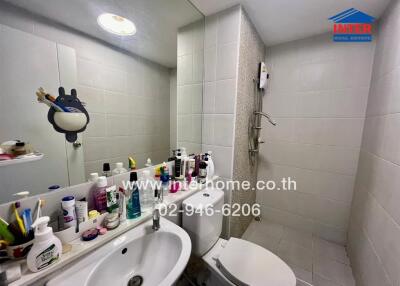 Well-equipped bathroom with modern shower and extensive toiletries