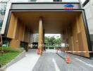 Modern condominium entrance with large archway