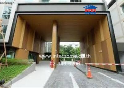 Modern condominium entrance with large archway