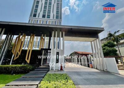 Modern high-rise residential building entrance with stylish design
