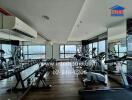 Spacious gym with modern equipment and city view