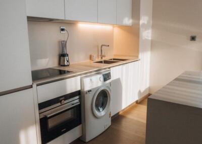 Modern kitchen with integrated appliances and wooden cabinets