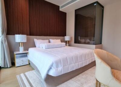 Elegant modern bedroom with natural light and stylish furnishings