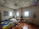 Unkempt bedroom with worn furnishings and exposed ceiling