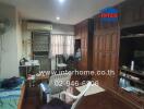 Spacious bedroom with wooden furniture and air conditioning unit