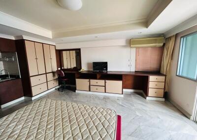 Spacious bedroom with large wardrobe and work desk