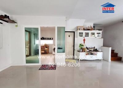 Spacious and bright living room with connected hallway