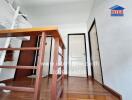 Interior view of a wooden staircase with white walls and a clean design in a modern home