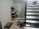 Bright and clean hallway with staircase, ideal for modern living