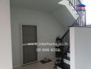 Modern stairway in a residential house with neutral color walls and convenient storage space under the stairs