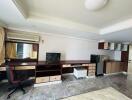 Spacious bedroom with workstation and ample storage