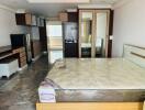 Spacious bedroom with integrated kitchenette and ensuite bathroom