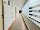 Long corridor in a residential building with multiple apartment doors