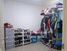 cluttered bedroom with extensive wardrobe and storage units