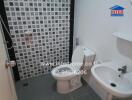 Compact tiled bathroom with modern fixtures