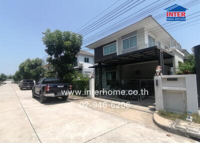 Modern two-story house with a covered carport