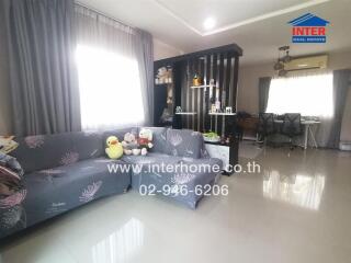 Spacious and well-furnished living room with connected dining area