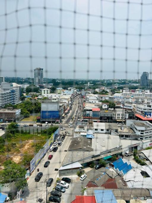 Aerial view of a busy urban street from a high-rise building