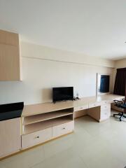 Spacious and modern living room with built-in storage and desk space