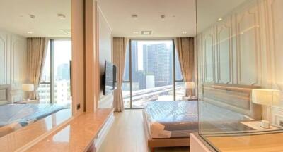 Modern bedroom with city view and ample natural light