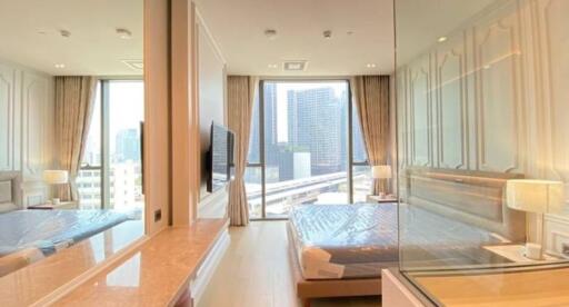 Modern bedroom with city view and ample natural light