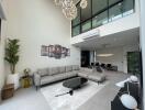 Spacious living room with modern decor and high ceiling