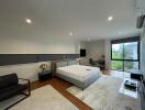Spacious modern bedroom with large bed and stylish decor