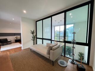 Modern living room with large windows and minimalist decor