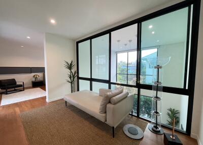 Modern living room with large windows and minimalist decor